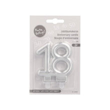 The PAPSTAR GmbH anniversary candles with holder, 7 cm "silver", is a silver number candle in multilingual packaging, ideal for birthdays or anniversaries, and includes a holder for easy use at celebrations.
