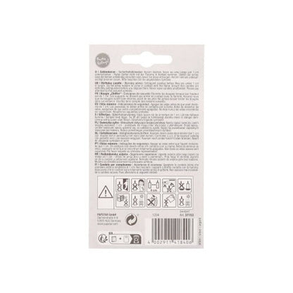 The back of a PAPSTAR GmbH number candle with holder 7 cm "silver" shows safety symbols, instructions, multilingual warnings, a barcode at the bottom, and a hole for hanging the candle on a display hook.