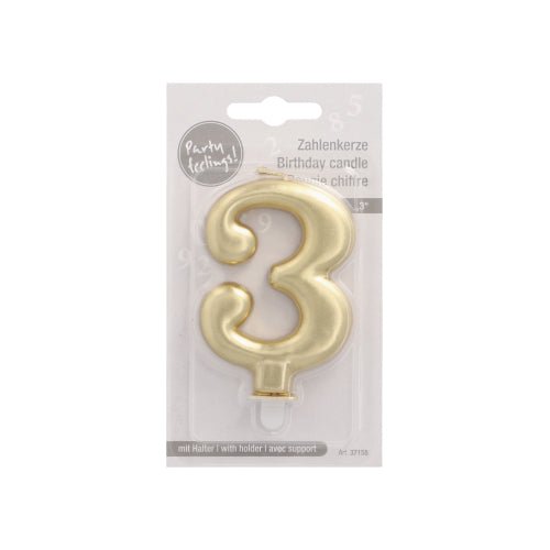 The PAPSTAR GmbH number candle with holder 7 cm "gold" is a stylish birthday candle in the shape of the number 3, ideal for cake decoration. It comes in a clear packaging with multilingual text "birthday candle" and a white cardboard back.