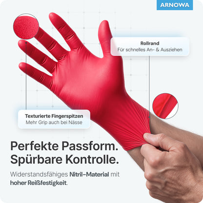 Shown is a hand with spread fingers wearing a red ARNOMED NITRIL LAVA RED disposable glove from ARNOWA GmbH. The text highlights textured fingertips, rolled cuff, and high tear resistance. Light blue background with ARNOWA logo in the top right corner.