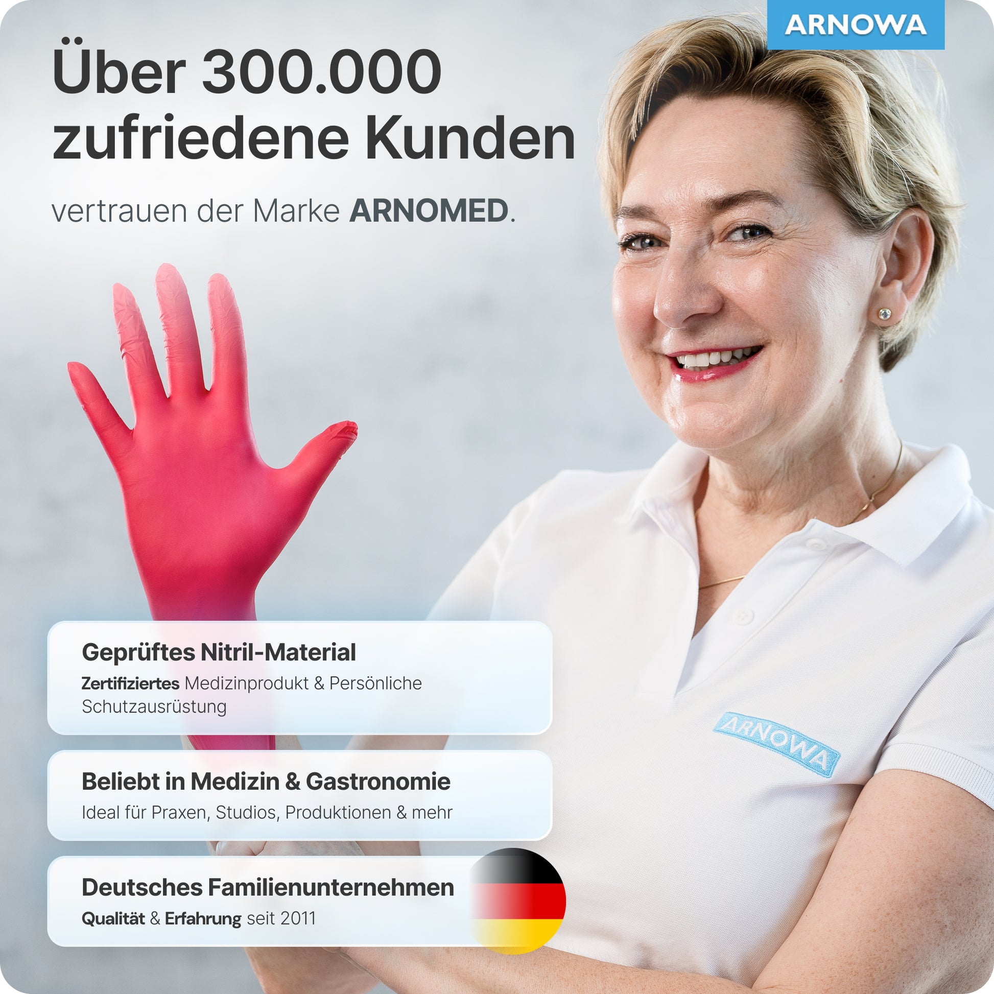 A smiling woman with short blonde hair is wearing a white shirt with the ARNOWA GmbH logo and holds her right hand in an ARNOMED NITRIL LAVA RED disposable glove. Product and company information appear on the left side.