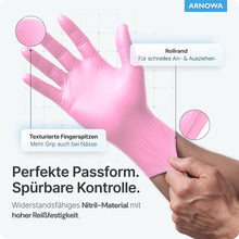 A hand is depicted in ARNOMED NITRIL BLOSSOM ROSE disposable gloves made of pink nitrile by ARNOWA GmbH. Textured fingertips provide grip, a rolled cuff allows for easy donning, and the glove offers a perfect fit, high tear resistance, and is latex-free.