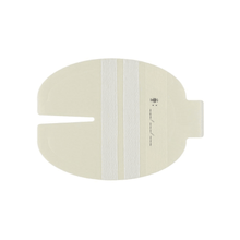 A beige plaster that fits around a medical device or surgical site is equipped with a central slit and two vertical white strips. Comparable to the 3M™ Tegaderm™ I.V. dressing with fabric reinforcement and fixation strips from 3M Healthcare Germany GmbH, it features a tab for easy application or removal.