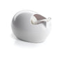 The Scotch™ Karim Rashid tape dispenser from 3M Deutschland GmbH is a white, oval tape dispenser with a tape roll inside, standing on a reflective white surface.
