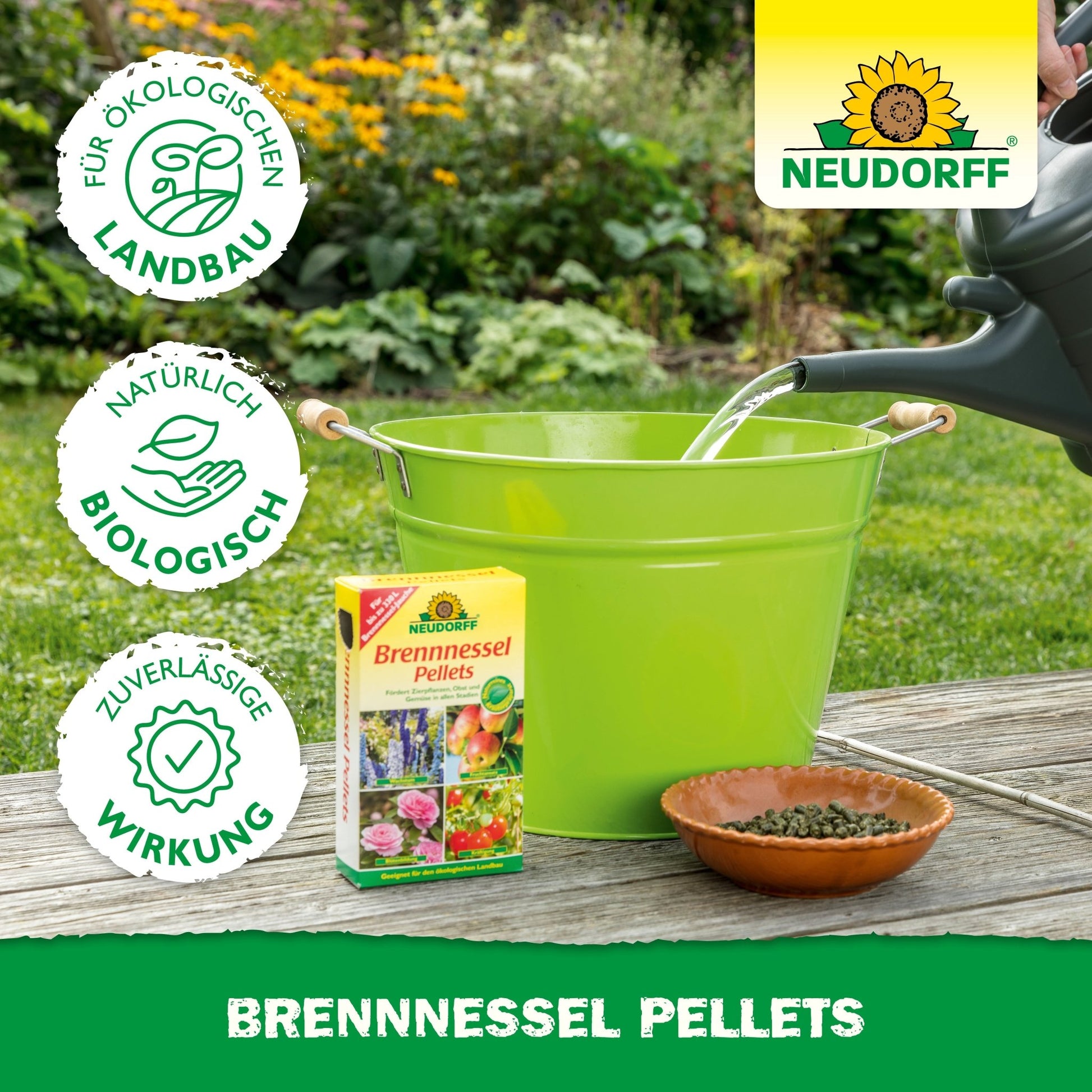 A green bucket and a brown bowl with Neudorff Shop Nettle Pellets stand outdoors. A watering can fills the bucket while a box of these pellets stands next to it - perfect as a plant tonic for your garden.