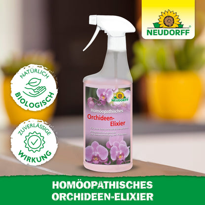 A spray bottle with "Homeopathic Orchid Elixir" from the Neudorff Shop, featuring pink orchids on its label. The blurred background shows yellow plant pots and green plants. An ideal care product for orchids.