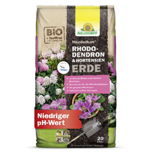 A 20-liter bag of NeudoHum Rhododendron & Hydrangea Soil from Neudorff Shop shows pictures of hydrangeas and rhododendrons and promotes optimal plant growth due to its low pH value.