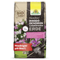 A 40-liter bag of Neudorff Shop's NeudoHum Rhododendron & Hydrangea Soil, a substrate with a low pH value. The packaging features blooming rhododendrons and hydrangeas, with detailed product information in German.