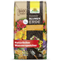A 40-liter bag of NeudoHum potting soil from Neudorff Shop with floral motifs, a trowel, and labels highlighting organic quality and natural water storage - perfect for garden plants and high-quality planting substrate.