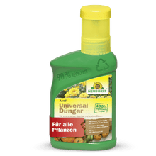 On a green plastic bottle of Neudorff Shop Azet Universal Liquid Fertilizer with a yellow cap, labeled "For all plants" and "100% organic vegan", vegetables and flowers are depicted, emphasizing the balanced nutrient ratio.