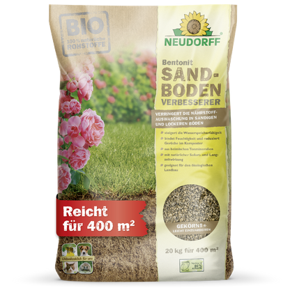 A 20-kg bag of Neudorff Shop Bentonite Sand Soil Improver stands upright; the packaging shows grass, flowers, and highlights "clay minerals," "improve sandy soil," and "store nutrients." Covers up to 400 m².