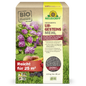 A box of Neudorff's UrgesteinsMehl from the Neudorff Shop stands upright and displays pictures of hydrangeas, apples, and grass. The 2.5 kg package is sufficient for 25 m² and is intended to improve soil fertility.