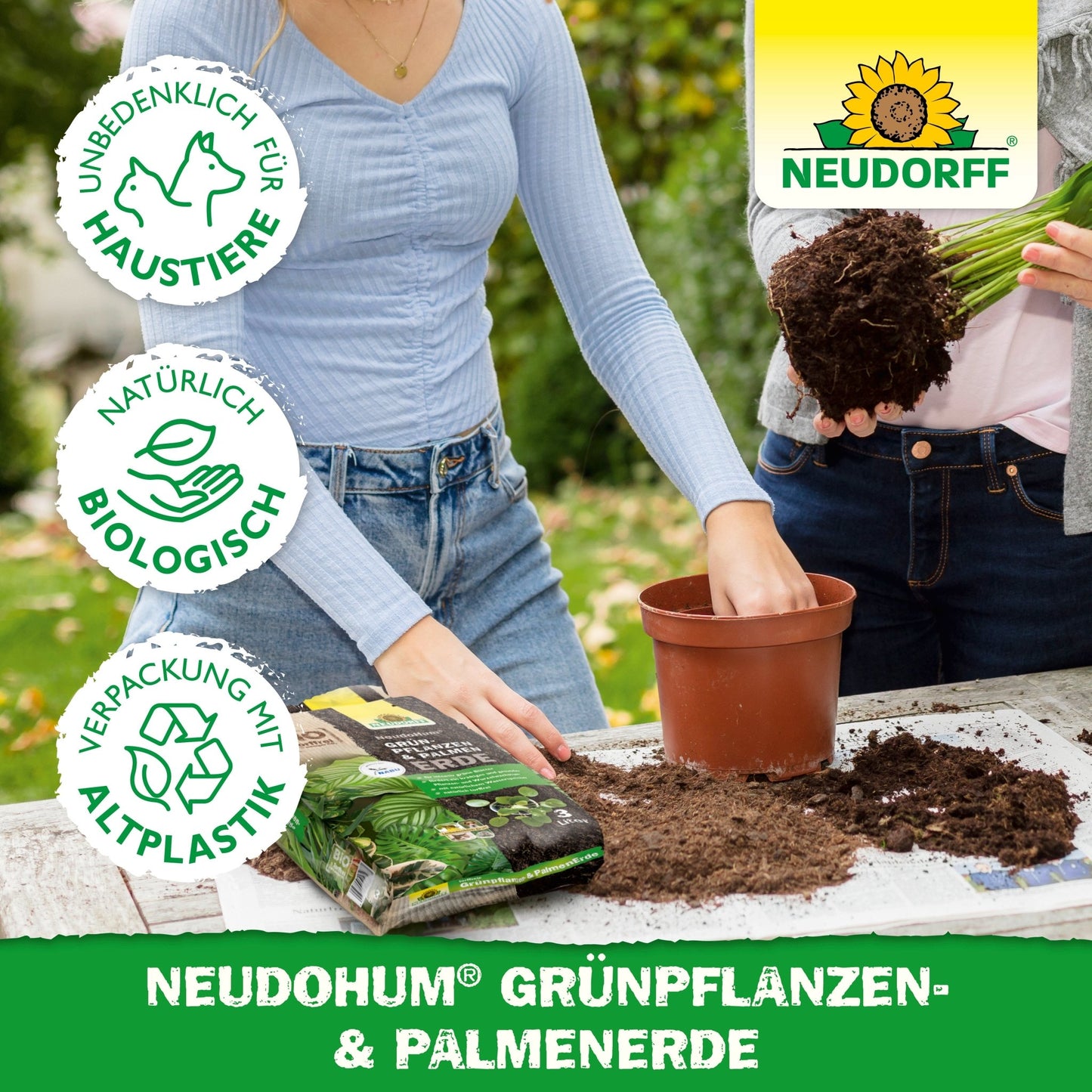 Two people are repotting a houseplant with NeudoHum Green Plant & Palm Soil from the Neudorff Shop - one is watering the soil, the other is holding the plant. Environmentally friendly, pet-friendly labels and the features of a natural water reservoir are highlighted.