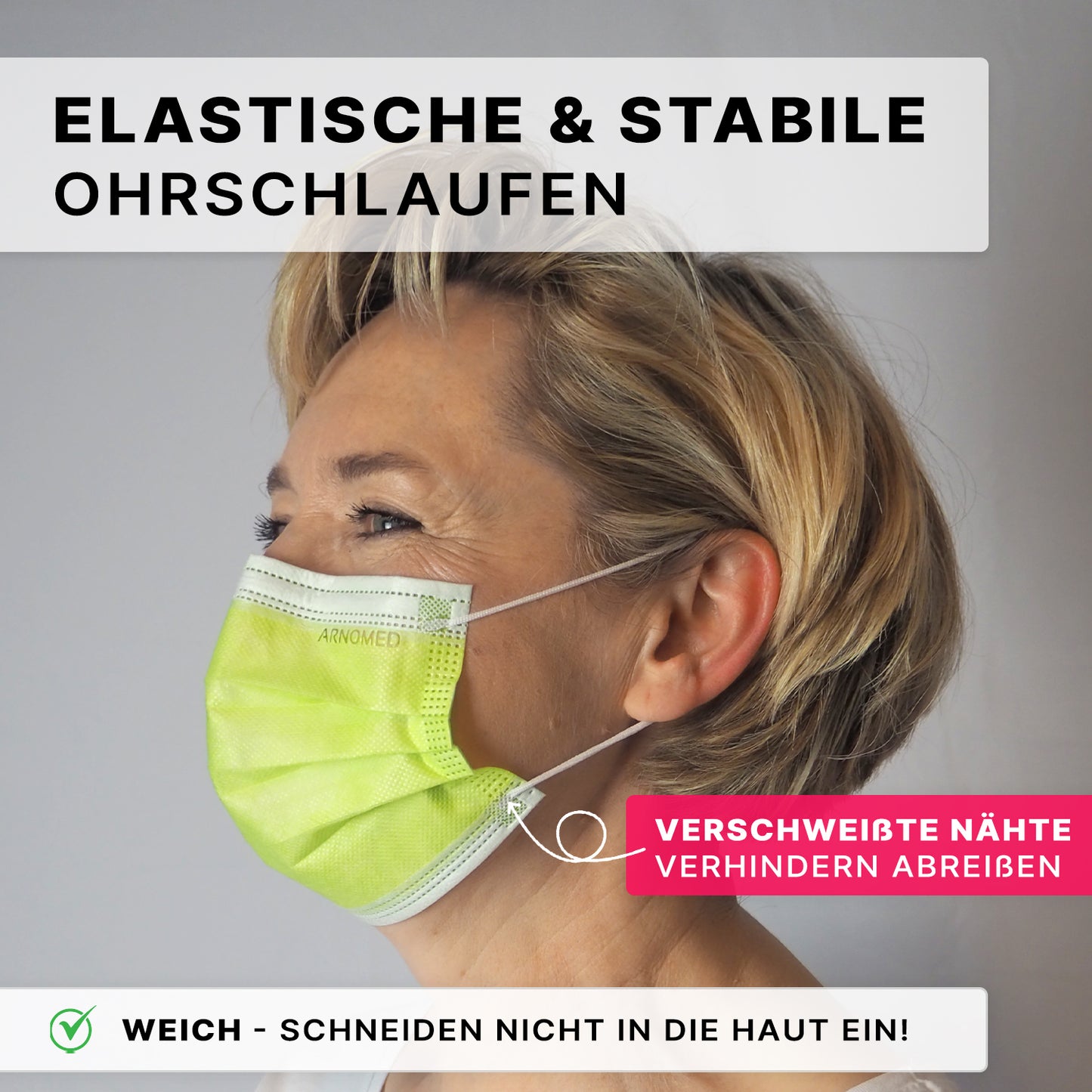 A woman with short blonde hair wears the ARNOMED MOUTH PROTECTION TYPE IIR surgical mask with rubber bands Type IIR from ARNOWA GmbH, a light green mask with elastic and stable ear loops, sealed seams to prevent tearing, and a soft, skin-friendly design.
