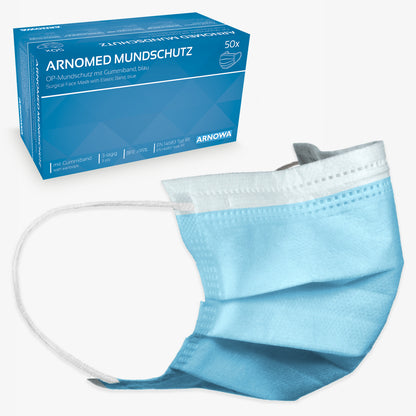 Behind a single light blue disposable mask with white elastic ear loops stands a blue box labeled "ARNOMED MOUTH PROTECTION TYPE IIR surgical mask with rubber bands Type IIR" from ARNOWA GmbH, with a mask image and German text.