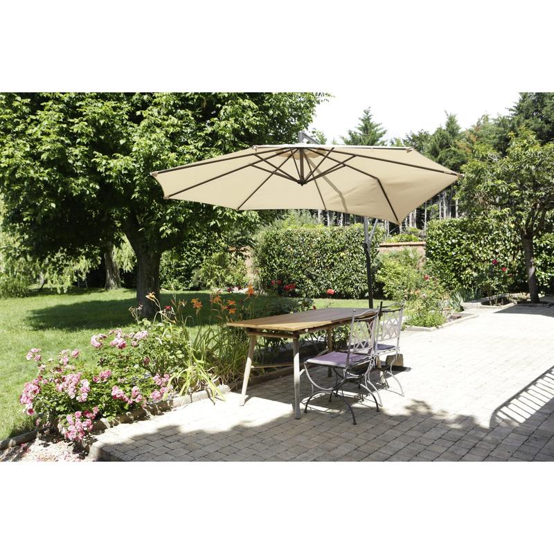 A terrace with a wooden table, two metal chairs, and a large beige umbrella is surrounded by greenery - showcasing the Scotch® Extremium™ Ultra High Performance Tape DT17 by 3M Deutschland GmbH for extreme outdoor use.