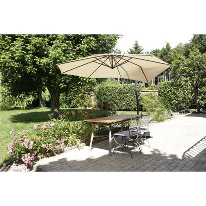 A terrace with a wooden table, two metal chairs, and a large beige umbrella is surrounded by greenery - showcasing the Scotch® Extremium™ Ultra High Performance Tape DT17 by 3M Deutschland GmbH for extreme outdoor use.