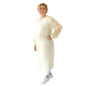 A person is standing smiling with one hand on their hip, wearing the ARNOMED virus-tight disposable protective gown (yellow, PP/PE coating, 10 pieces) by ARNOWA GmbH over white pants and shoes against a plain white background.