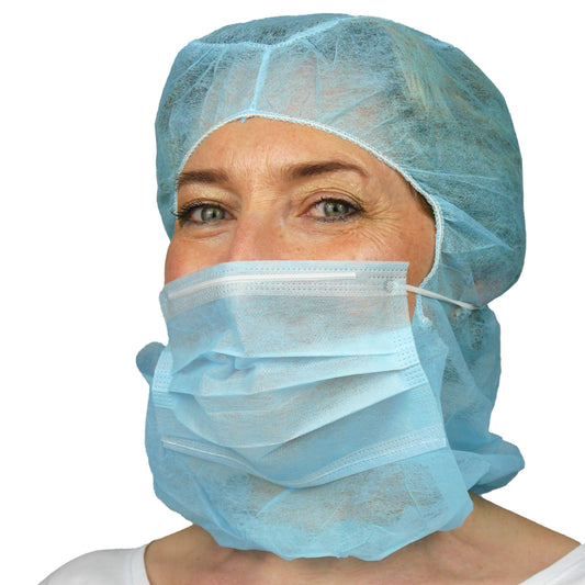 A person wearing the ARNOMED COVER PP-ASTROHAUBE WITH 2-LAYER MOUTH PROTECTION from ARNOWA GmbH, in blue, and a blue disposable beard cover stands against a white background.