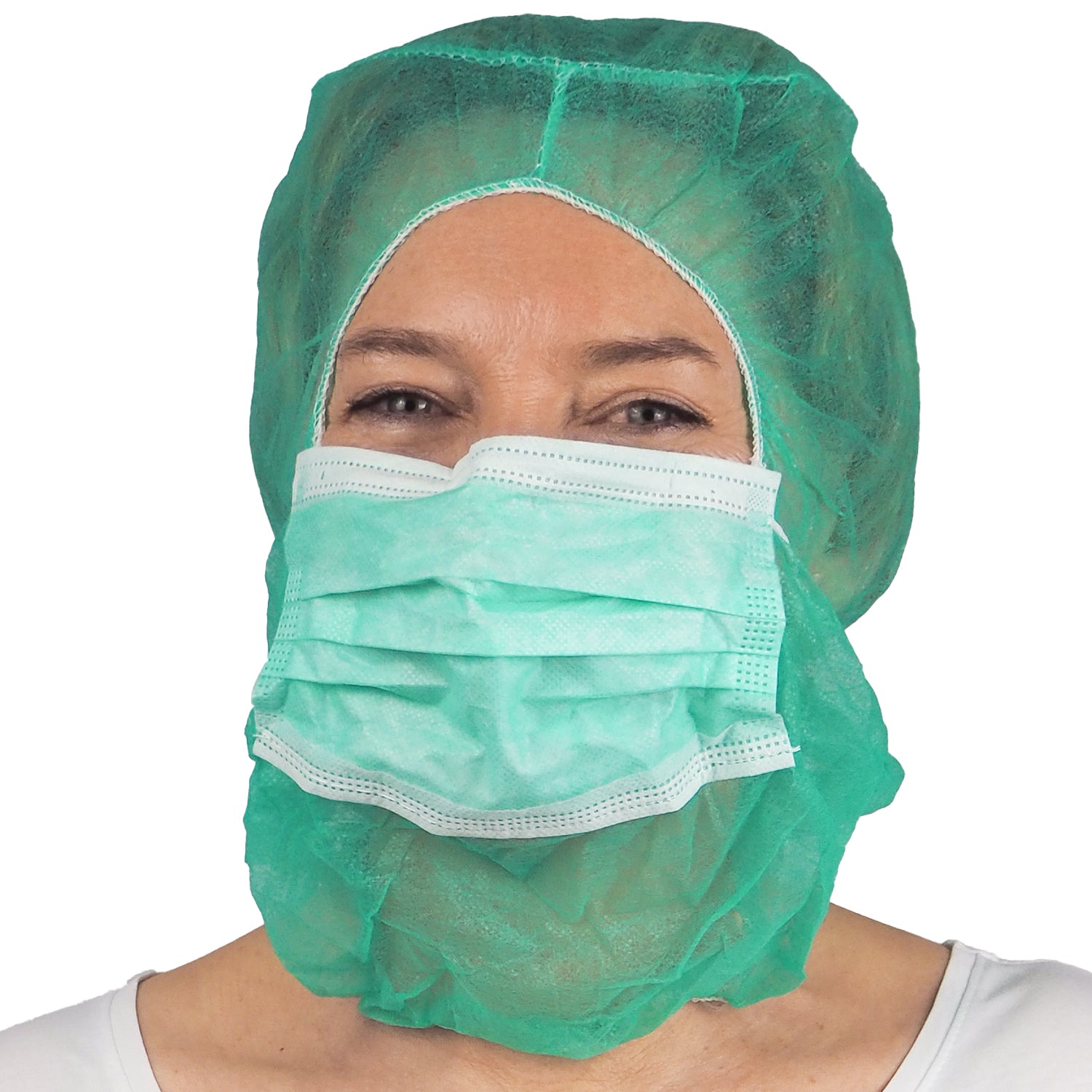 A person wearing a green ARNOMED COVER PP-ASTROHAUBE WITH 2-LAYER MOUTH PROTECTION from ARNOWA GmbH made of disposable material faces the camera against a white background.