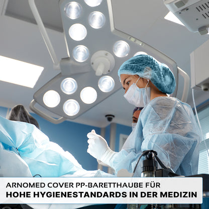 A doctor in surgical clothing stands in an operating room preparing the equipment. The German text reads: "ARNOMED COVER PP-BARETTHAUBE bouffant cap made of PP non-woven fabric by ARNOWA GmbH - Disposable headgear for high hygiene standards."