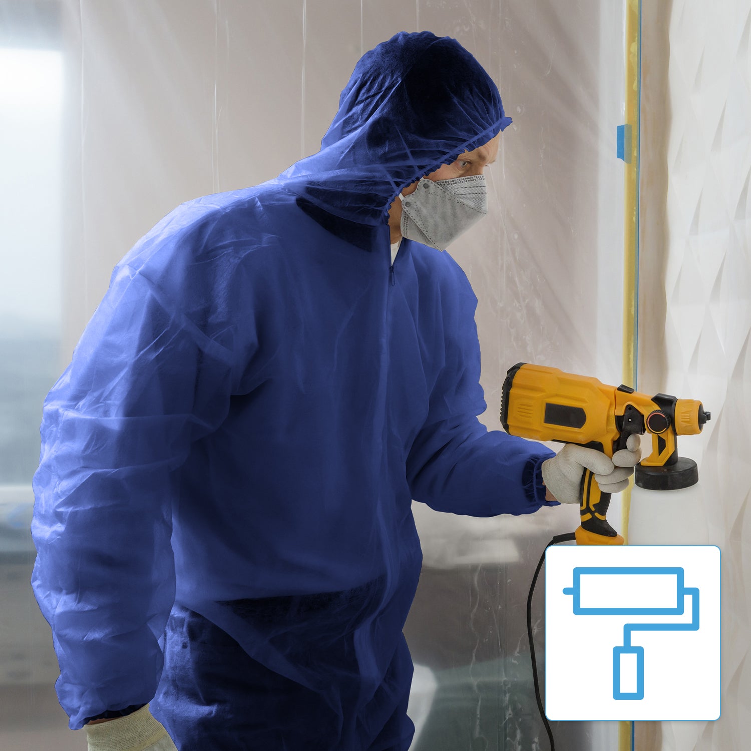 A person wearing the ARNOMED COVER PP-OVERALL XTRA STRONG disposable coverall with a hood in blue by ARNOWA GmbH, gloves, and a face mask, uses a yellow paint sprayer indoors. Part of the work area is covered with plastic sheeting. A paint roller symbol is visible.