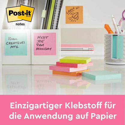 A desk with 3M Deutschland GmbH Post-it® Notes, 76 mm x 76 mm, 100 sheets/block, 100% PEFC. A sign reads "Unique adhesive for use on paper." The Post-it notes logo is visible at the top.