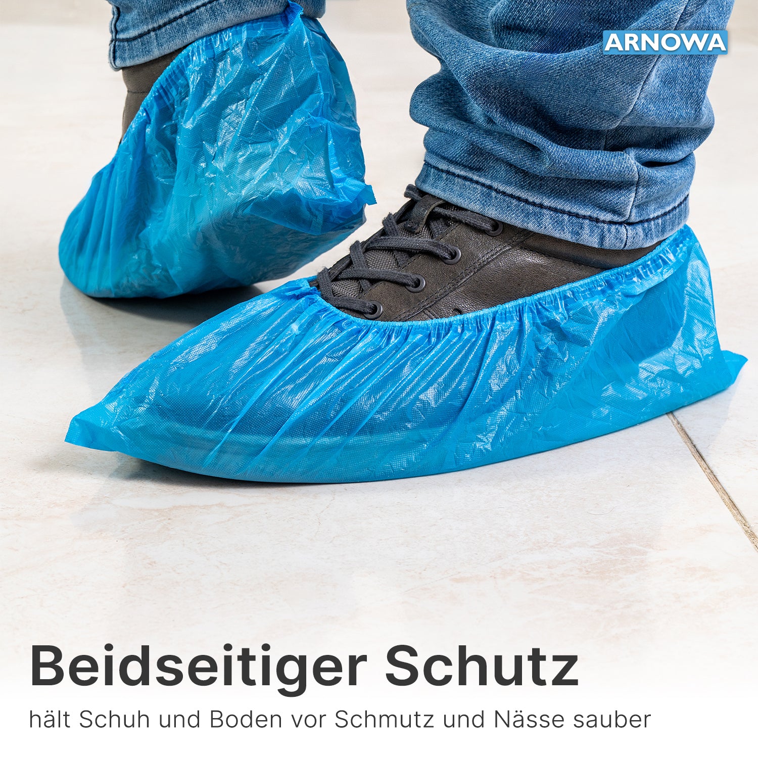 A person wears ARNOMED CPE shoe covers from ARNOWA GmbH over dark shoes on light tiles. At the edge of the image, protection for shoes and floors from dirt and moisture is advertised. Bag with 100 pieces, waterproof, disposable.