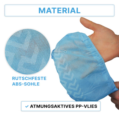 A hand is holding an ARNOMED ABS shoe cover, disposable (ARNOWA GmbH). An enlarged circle shows the non-slip textured sole. Text: "Non-slip ABS sole" and "Breathable PP nonwoven fabric." Package contains 100 pieces.