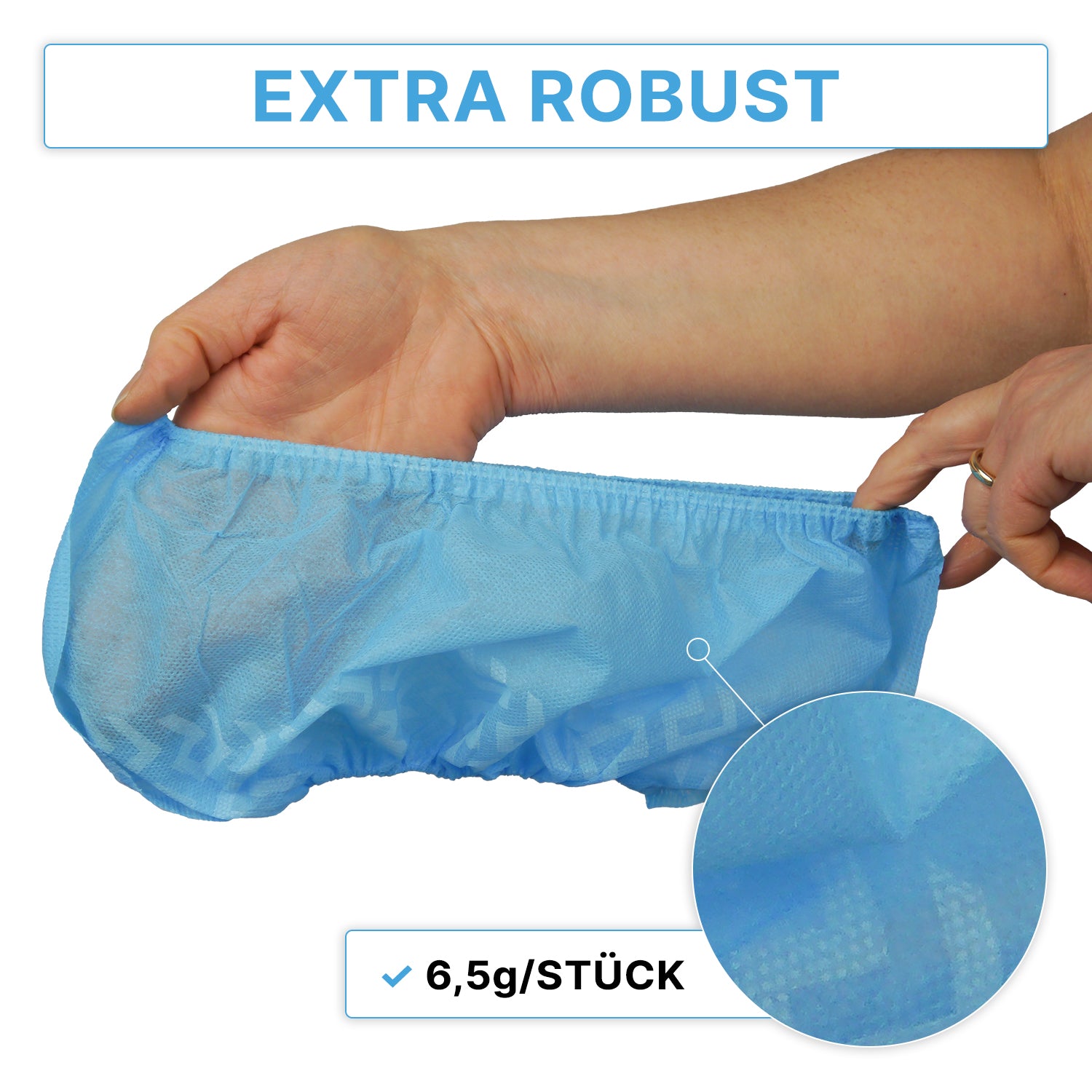 A hand is holding a blue ARNOMED ABS shoe cover—non-slip, disposable—manufactured by ARNOWA GmbH, featuring a textured pattern. At the top is the text "EXTRA ROBUST" and below it "6.5 g/PIECE," along with a close-up of the shoe cover material. The bag contains 100 pieces.