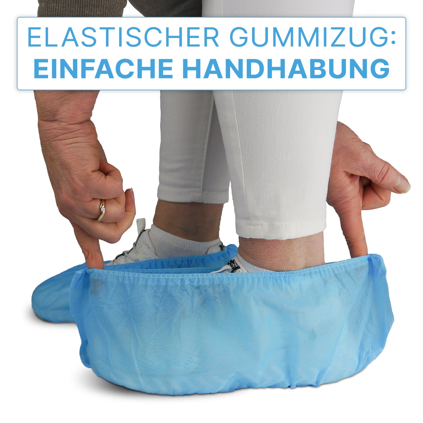 Someone is pulling an ARNOMED ABS shoe cover—non-slip, disposable (ARNOWA GmbH)—over a white sneaker. A sign above it reads: "Elastic band: Easy to use."