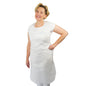 A person is standing smiling with one hand on their hip, wearing the ARNOMED COVER PE-APRON Blocked Disposable Aprons made of PE by ARNOWA GmbH over a white shirt and pants against a plain white background.