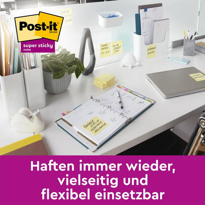 A tidy desk with a laptop, planner, supplies, and Post-it® Super Sticky Notes (47.6 x 47.6 mm, 90 sheets/block, 100% PEFC) from 3M Deutschland GmbH attached to items. Text below in German: "Stick again and again...