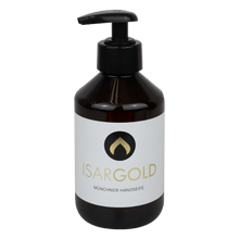 A dark brown 250 ml plastic pump bottle of Dr. Schnell ISARGOLD hand soap, Munich quality, from DR.SCHNELL GmbH & Co. KGaA, with a white label and black-gold logo, ideal for personal hygiene and sensitive skin.