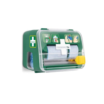 The Cederroth Soft Foam Bandage 2-in-1 Dispenser from Orkla Wound Care AB is a green-and-white wall-mounted set with a transparent lid that contains bandages (6 pieces) and features illustrated instructions on the front.