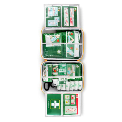 The Cederroth first aid kit for burns by Orkla Wound Care AB is opened and shows organized compartments with bandages, scissors, and instruction cards with visual guides at the top and bottom of the kit.