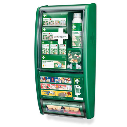The Cederroth First Aid Station by Orkla Wound Care AB is a green, wall-mounted first aid kit, delivered in a pack with bandage packs, wound spray, burn gel dressings, soft foam and adhesive bandages, and an illustrated guide on the front.