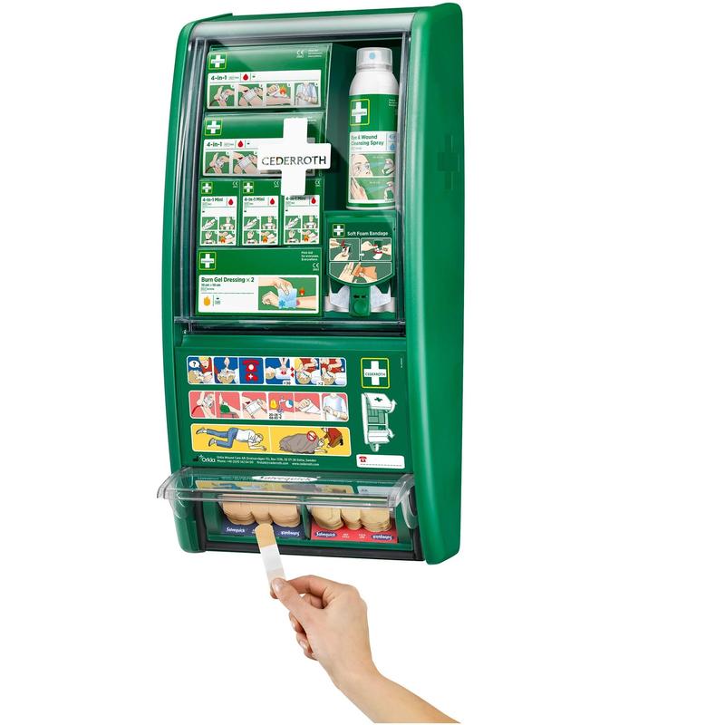 The Cederroth first aid station by Orkla Wound Care AB is a green, wall-mounted first aid kit with labeled compartments and instructive pictures. A hand is depicted pulling a plaster from the lower compartment. (1 pack/carton).