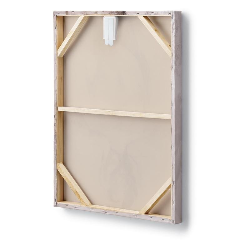 The image shows the back of a rectangular stretched canvas with a wooden frame and reinforced corners, with a white Command™ canvas hanger from 3M Deutschland GmbH attached at the top.