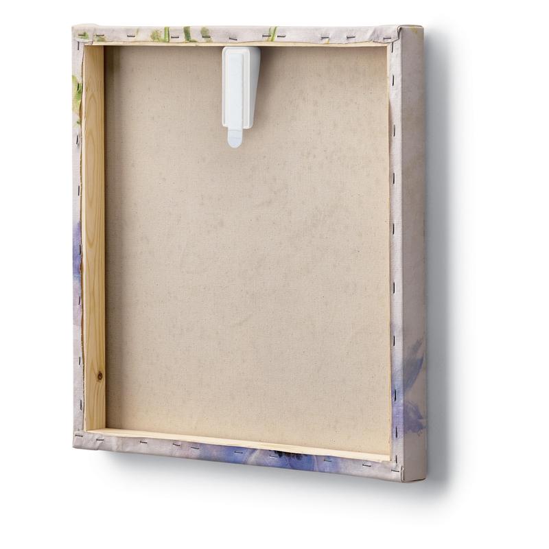 The image shows the back of a square stretched canvas with an exposed wooden frame and visible staples along the edges. Above the canvas, a Command™ canvas hanger from 3M Deutschland GmbH is attached for hanging on the wall.