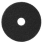 A black, round TASKI Americo Pad Black, an aggressive scrubbing pad from Diversey Deutschland GmbH & Co. OHG, with rough texture and central hole, viewed from above against a white background.