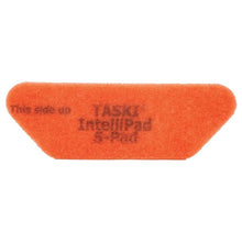 A bright orange, rectangular TASKI Intellipad S-Pad cleaning and polishing pad from Diversey Deutschland GmbH & Co. OHG with beveled edges and the text "This side up TASKI IntelliPad S-Pad", photographed unused on a white background. Package (1 piece).