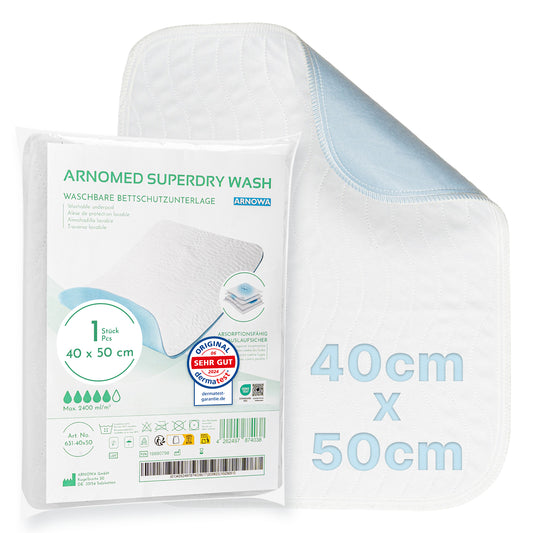 The ARNOMED SUPERDRY WASH Washable Bed Protection Pad by ARNOWA GmbH, 40x50cm, white with light blue underside and Superdry technology. Packaging with product details and care instructions in German.