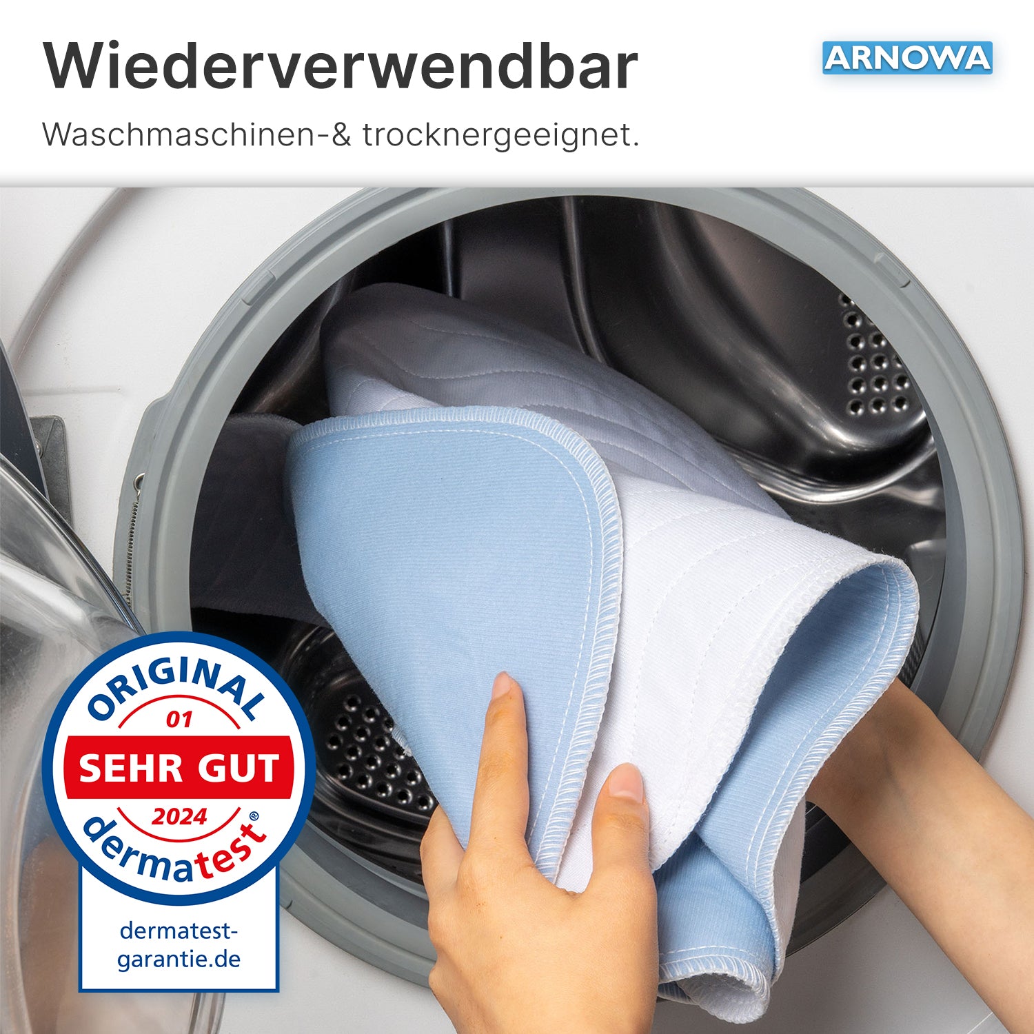 A hand places the ARNOMED Washable Bed Protection Pad with Wings, Superdry (ARNOWA GmbH) into a front-loading washing machine. Text notes: machine washable, dryer safe, ideal for incontinence; dermatest "Very Good" 2024.