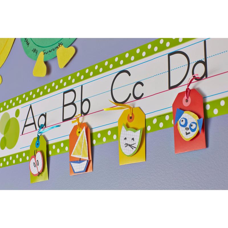 An alphabet strip for the classroom (A-D, uppercase/lowercase letters) has four colorful signs - apple, sailboat, cat, owl - attached with Scotch-FIX™ Removable Adhesive Pads 301008C36-P from 3M Deutschland GmbH, making them stable yet removable.