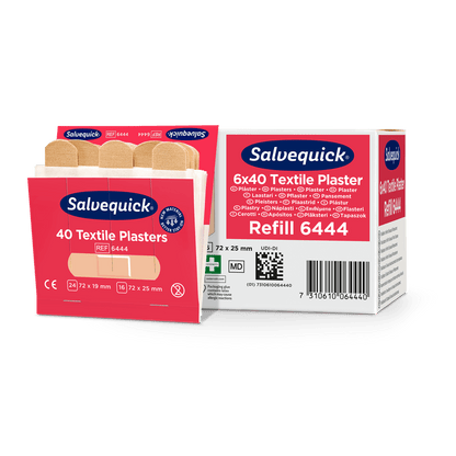 An opened box of Orkla Wound Care AB textile plaster, 40 pcs./refill lies next to a closed package (6 pieces), in which several beige plasters for wound care are visible.