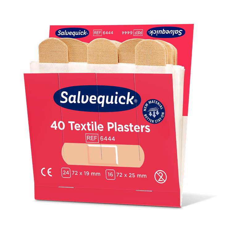 An opened package of Orkla Wound Care AB textile plaster, 40 pcs./refill (6 pieces), contains beige adhesive bandages. The red-white packaging includes product information, the Orkla logo, and a note on its use for wound care.