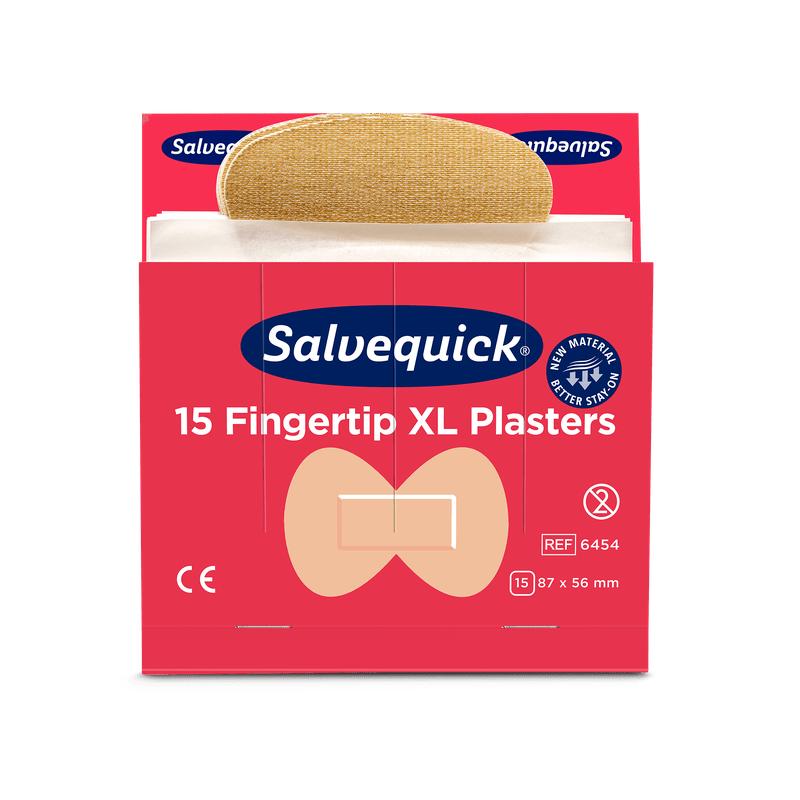 A red box of Orkla Wound Care AB XL Fingertip Textile Plasters, 15 pieces/mine (6 piece pack), with a partially removed plaster. The packaging displays the CE mark, dimensions, and an illustration of the fingertip shape.