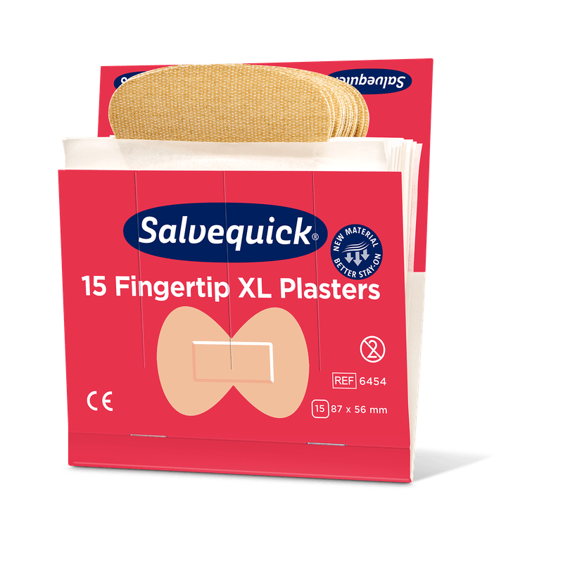 An opened box of Orkla Wound Care AB XL Fingertip Textile Plasters, 15 pieces/mine (pack of 6 pieces), shows beige fingertip plasters. The red box measures 87 x 56 mm and highlights the flexible design of the textile plaster.