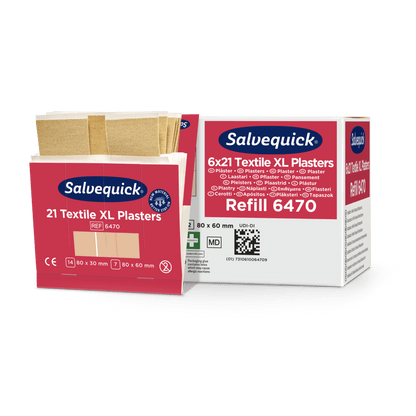 Pictured are two Orkla Wound Care AB XL textile plaster boxes (21 pieces/package, 6 pieces) - one open with bandages, one closed. For small injuries; sizes: 80x30 mm, 80x60 mm; Ref: 6470. Piece counts: 21/126.